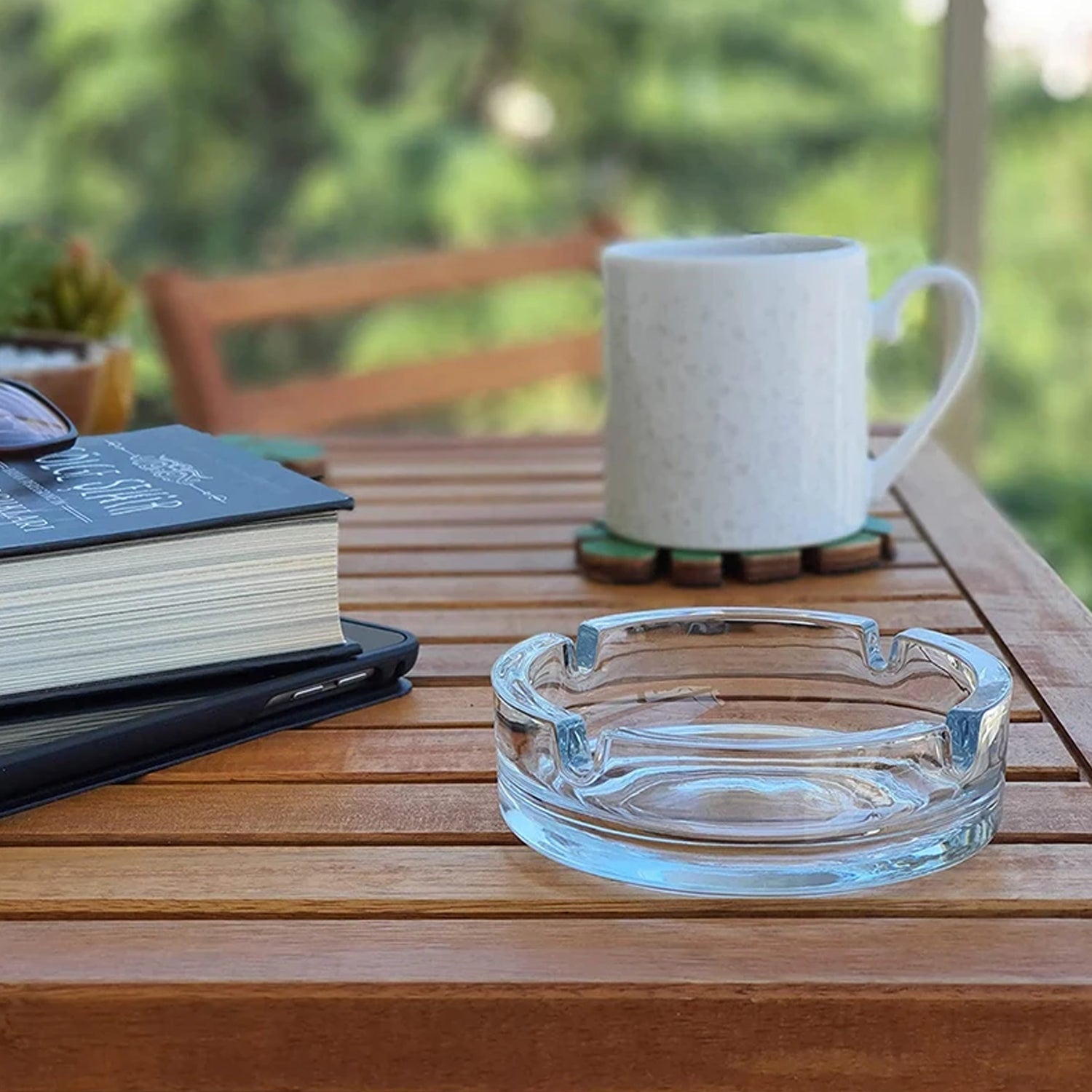 Elegant crystal ashtray with a smooth finish.