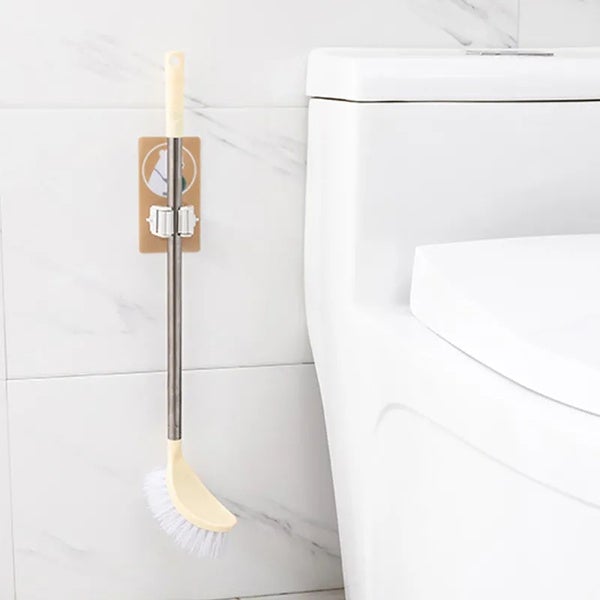 Magic sticker mop and broom holder for keeping cleaning tools organized.