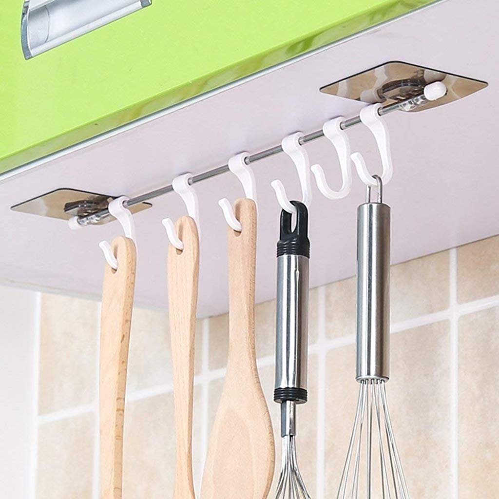 Adhesive hanger hooks, plastic, for organizing items securely.